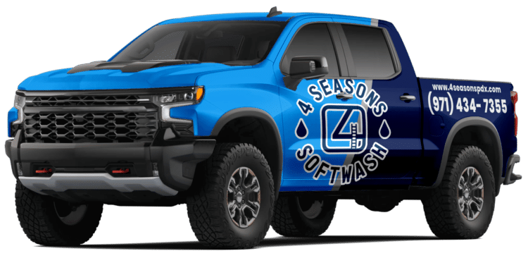 A blue and dark blue wrapped truck for 4 Seasons Softwash, a pressure washing company, with the company logo and phone number (971) 434-7355 displayed on the side.