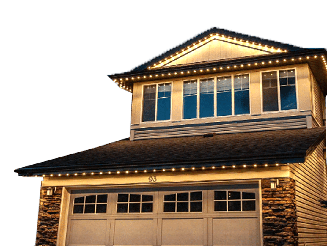 A two-story house is adorned with permanent holiday lighting in Portland OR, accentuating the roofline and garage. The lights glow warmly against the dusk sky, highlighting the architectural details of the home. The house number "93" is visible above the garage.