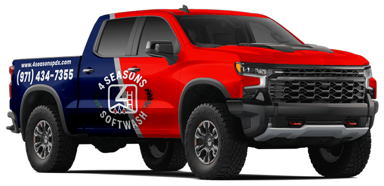 A red and blue Chevy Silverado truck, branded for 4 Seasons Softwash, advertises commercial Christmas lighting services in Portland, OR. The truck features the company's logo and phone number: (971) 434-7355.